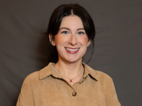 Woman in brown shirt smiling