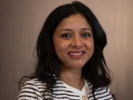 Shital smiling at the camera