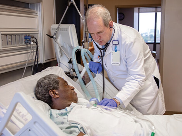 Patient with a cardiac condition being treated by a therapist