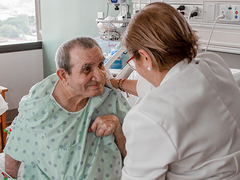 Patient with a neurological condition being treated by a therapist 