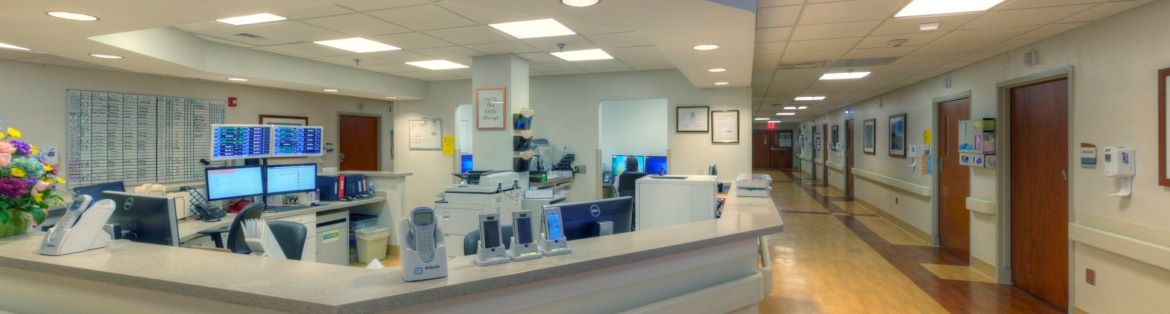 The Select Specialty Hospital Hampton Roads nursing station and hospital hallway.