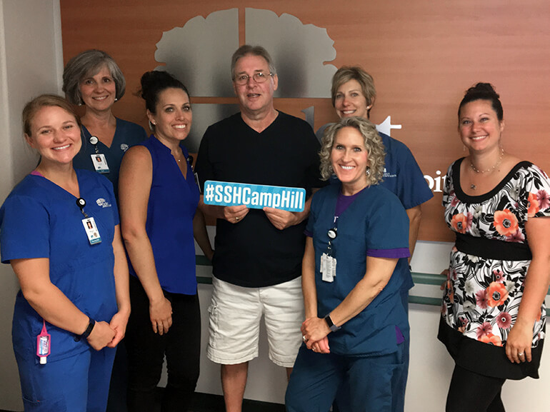 Curt standing with his team of caregivers at Select Specialty Hospital, Camp Hill, PA after recovering from Guillain-Barre.