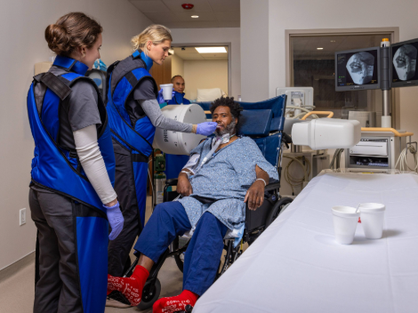 A patient on a ventilator completes a swallow study to evaluate their throat muscles utilizing advanced technology.