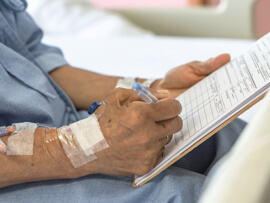 male patient writing his advanced directive