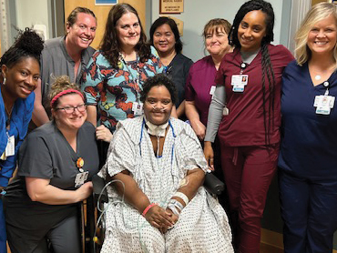 Alessia and her care team smile for the camera.