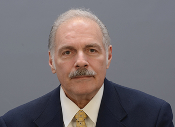 Dr. Hamaty looking at the camera.