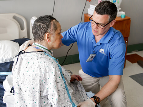 Patient with brain injury being treated by a therapist