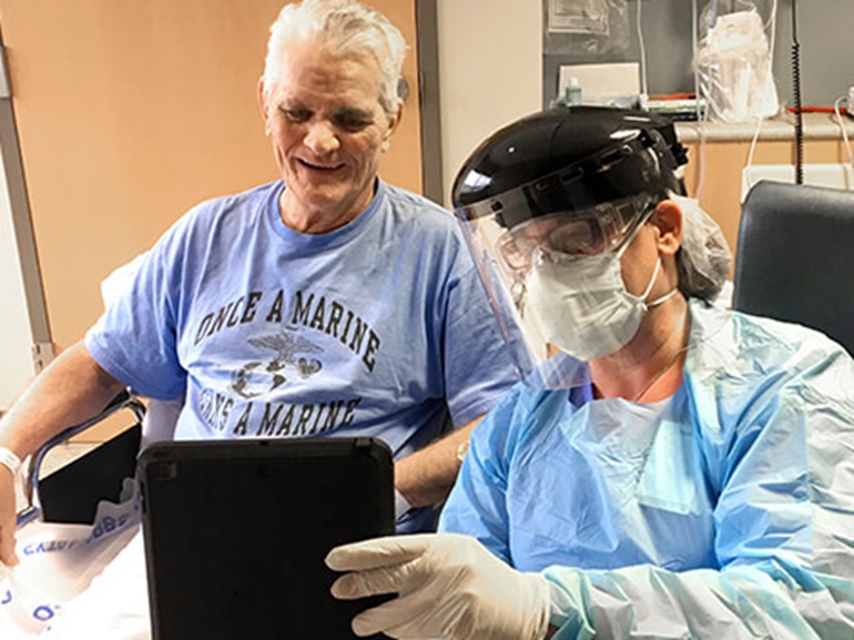Patient with an infectious disease being treated by a therapist