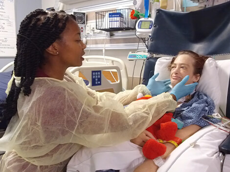 Patient with a medically complex condition being treated by a therapist