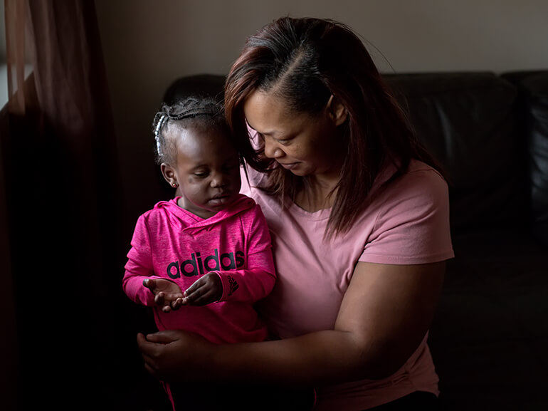 Outcomes - woman holding daughter