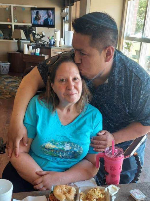 Christine being welcomed home.