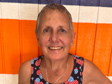 Debbie smiling at the camera.