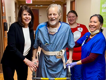 Obrien and his care team smiling at the camera.