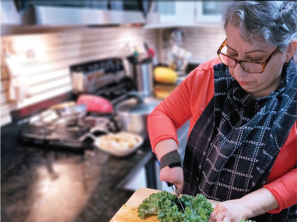 Zoila using a tool to cut vegetables.