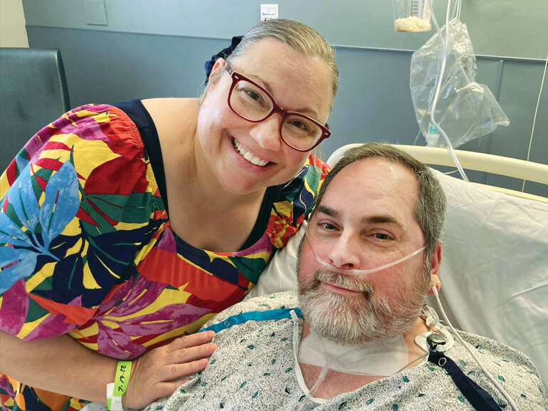 George smiling with his wife, Redonia.