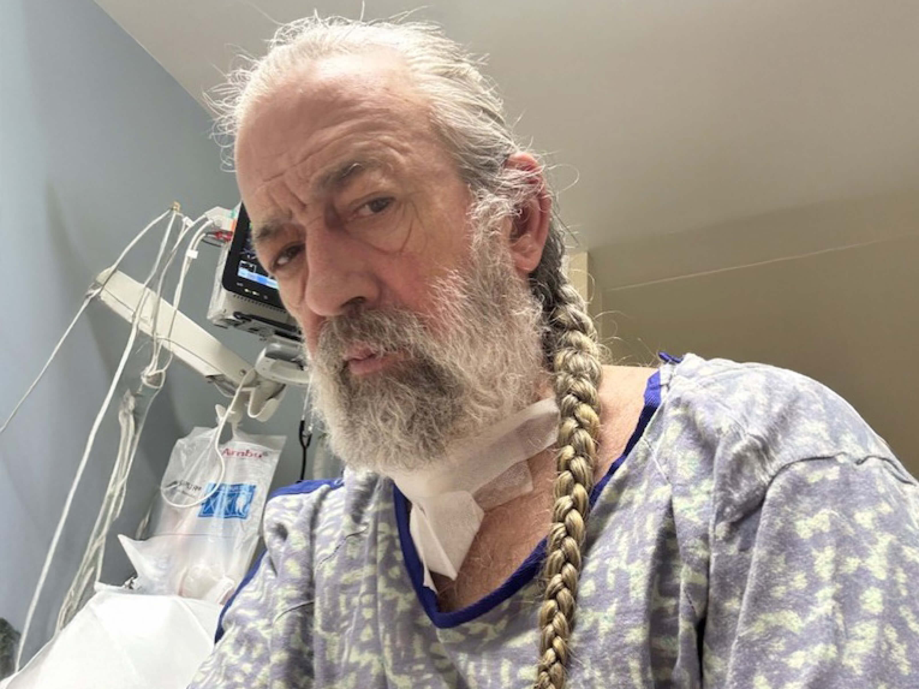 Greg Walker sits up in his hospital room.