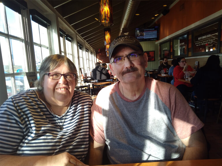 Joe smiling with his wife, Denean.