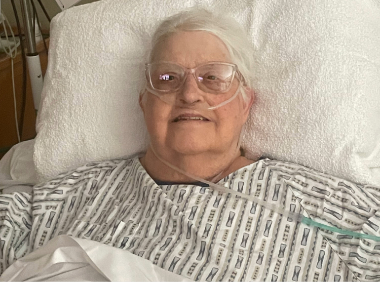 Patricia smiling in her hospital bed