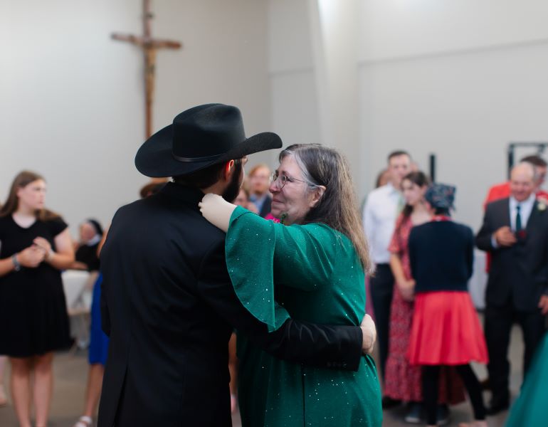 Stacy dances with her son at his wedding following her medical journey at Select Specialty Hospital.
